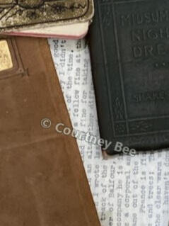 Vintage books, papers, and a box of Crayola crayons